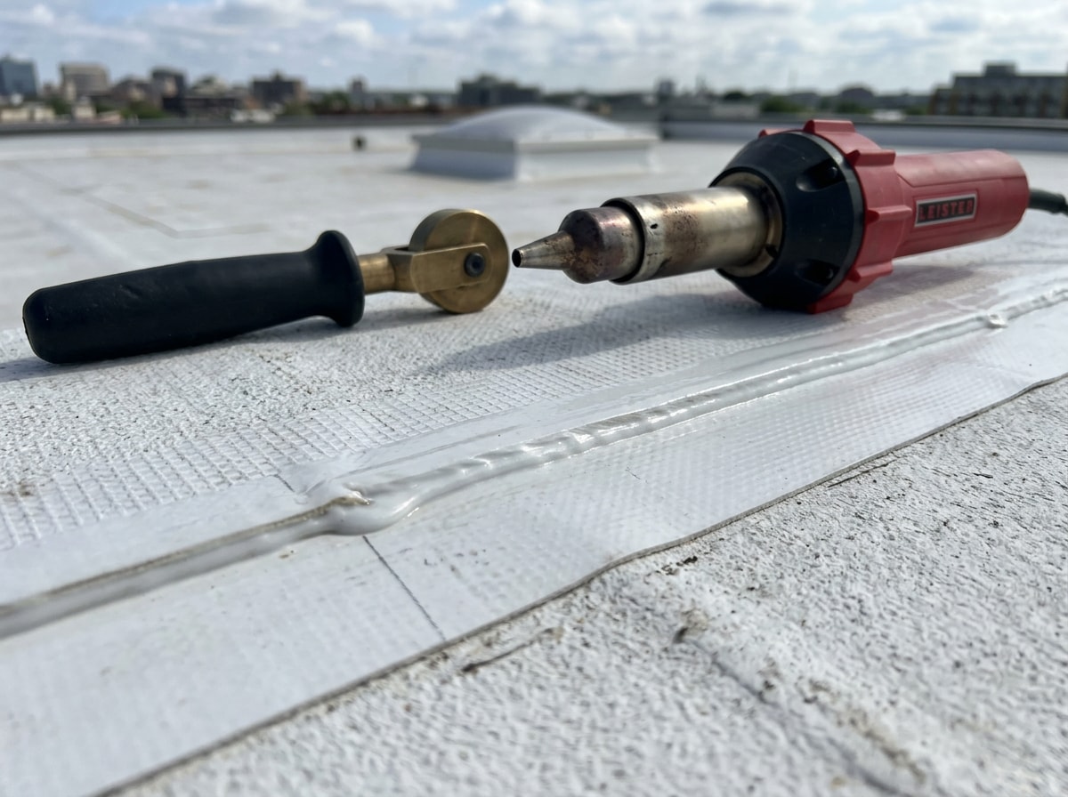 Close-up of a heat-welded TPO roof seam on a commercial flat roof